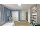 Spacious bedroom featuring blue accent wall, closet, shelving, and light wood floors at 13413 Hopkinton Ct, Windermere, FL 34786