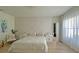 Comfortable bedroom featuring natural light, stylish headboard and neutral color tones at 13413 Hopkinton Ct, Windermere, FL 34786