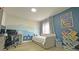 Cozy bedroom featuring daybed, desk, wall art, and wood-look floors at 13413 Hopkinton Ct, Windermere, FL 34786