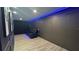 Home theater featuring tiered seating, custom lighting, and sleek design at 13413 Hopkinton Ct, Windermere, FL 34786