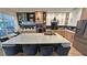 Modern kitchen featuring a large center island with seating, stylish countertops, and stainless steel appliances at 13413 Hopkinton Ct, Windermere, FL 34786