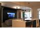Open-concept kitchen with a large island, modern fixtures, and a view of the living room at 13413 Hopkinton Ct, Windermere, FL 34786