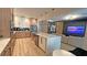 Open kitchen featuring stainless steel appliances and a center island, with adjacent living space at 13413 Hopkinton Ct, Windermere, FL 34786