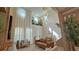 Bright open-concept living room featuring high ceilings, large windows, and modern decor at 13413 Hopkinton Ct, Windermere, FL 34786
