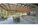 Spacious outdoor kitchen with a large patio, dining table, and stainless steel grill, perfect for entertaining guests at 13413 Hopkinton Ct, Windermere, FL 34786