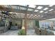 Expansive outdoor patio with pergola, dining area, outdoor kitchen, and comfortable seating arrangement at 13413 Hopkinton Ct, Windermere, FL 34786