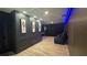 Home theater boasting blue LED lighting and comfortable seating at 13413 Hopkinton Ct, Windermere, FL 34786
