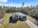 A single Gathering home on a large lot with a long interlocking brick driveway at 15163 Sw 29Th Terrace Rd, Ocala, FL 34473