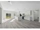 Bright, open-concept kitchen with a center island, stainless appliances, and sliding glass doors to the backyard at 15163 Sw 29Th Terrace Rd, Ocala, FL 34473