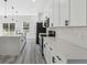 Well-lit kitchen featuring stainless steel appliances, white cabinetry, and a spacious center island at 15163 Sw 29Th Terrace Rd, Ocala, FL 34473