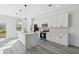 Bright, spacious kitchen featuring an island, modern appliances, and a large picture window at 15163 Sw 29Th Terrace Rd, Ocala, FL 34473
