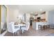 An open kitchen/dining area with stainless steel appliances, and a peninsula island at 1928 Tamarack Pass, Davenport, FL 33837