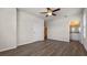 Large bedroom featuring wood floors, ceiling fan, and ensuite bathroom at 2171 Longleaf Rd, Davenport, FL 33837