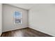 Well-lit bedroom with wood-look floors, a window, and neutral walls at 2171 Longleaf Rd, Davenport, FL 33837