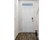 Inviting front door with modern digital lock and sidelight window, enhancing security and natural light at 2171 Longleaf Rd, Davenport, FL 33837
