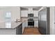 Modern kitchen boasting granite counters, stainless steel appliances, and a convenient dishwasher at 2171 Longleaf Rd, Davenport, FL 33837