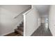 Stylish stairway showcases modern wood steps and white railings, blending seamlessly with the hardwood flooring at 2171 Longleaf Rd, Davenport, FL 33837