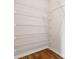 This walk-in closet has white wire shelving and a wood floor at 2171 Longleaf Rd, Davenport, FL 33837