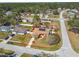 Aerial view of the property highlighting the landscaping, roof, and surrounding neighborhood at 2398 Whitehorse St, Deltona, FL 32738