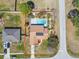 Birds eye view of home featuring a private pool, enclosed yard, and solar panels at 2398 Whitehorse St, Deltona, FL 32738