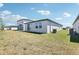 Backyard featuring a patio and green space, perfect for outdoor enjoyment at 2513 Merseyside Ct, Haines City, FL 33844
