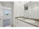 Bathroom featuring dual sinks, granite counters, and a walk-in shower at 2513 Merseyside Ct, Haines City, FL 33844