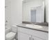 Bathroom with a white vanity, sink, and a toilet with a shower-tub combination at 2513 Merseyside Ct, Haines City, FL 33844