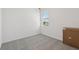 Bedroom with a window and carpet flooring, offering a cozy and comfortable space at 2513 Merseyside Ct, Haines City, FL 33844