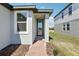 A charming house exterior with lush landscaping and a front door with glass panel at 2513 Merseyside Ct, Haines City, FL 33844