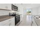 Featuring stainless steel oven and cooktop, with white cabinets at 2513 Merseyside Ct, Haines City, FL 33844