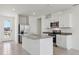 Well-lit kitchen with modern appliances, a central island, and ample counter space at 2513 Merseyside Ct, Haines City, FL 33844
