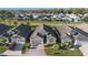 An aerial view of the house shows the driveway and surrounding neighborhood at 2634 Angel Falls Dr, Davenport, FL 33837