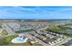 Expansive community showcasing modern homes, serene lakes, and a community pool at 2634 Angel Falls Dr, Davenport, FL 33837