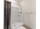 Bathroom featuring a shower and gray shower curtain at 2634 Angel Falls Dr, Davenport, FL 33837