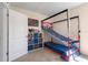 Bedroom featuring a unique bunk bed, play area, and storage shelves at 2634 Angel Falls Dr, Davenport, FL 33837