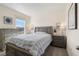 Bedroom with gray-toned furniture, a bright window, carpeted floors, and serene decor at 2634 Angel Falls Dr, Davenport, FL 33837