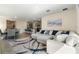 Open-concept living space with kitchen, dining, and living areas with modern decor at 2634 Angel Falls Dr, Davenport, FL 33837