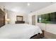 This main bedroom features carpeted floors, a dresser and mirror, and a TV at 2634 Angel Falls Dr, Davenport, FL 33837