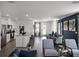 Open-concept living area featuring modern décor, wood flooring, and ample natural light at 2688 Gouda Dr, Apopka, FL 32703