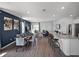 Open-concept living area featuring modern décor, wood flooring, and ample natural light at 2688 Gouda Dr, Apopka, FL 32703