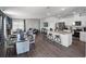 Open floorplan with sightlines from kitchen to dining to living spaces, fostering connection at 2688 Gouda Dr, Apopka, FL 32703