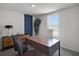 Modern office featuring a spacious desk, stylish decor, and a large window with a view at 2688 Gouda Dr, Apopka, FL 32703