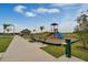 A community playground features a slide, water fountain, benches, walkway, and restroom building at 2688 Gouda Dr, Apopka, FL 32703