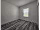A clean and bright bedroom with neutral walls and a window at 2693 Sw 153Rd Place Rd, Ocala, FL 34473