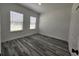 A sunlit bedroom with two windows and neutral wall paint at 2693 Sw 153Rd Place Rd, Ocala, FL 34473