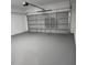 Spacious garage featuring freshly painted walls and floor, and a door opener at 2693 Sw 153Rd Place Rd, Ocala, FL 34473