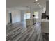 Bright kitchen with an island, sleek countertops, stainless steel appliances, and modern pendant lighting at 2693 Sw 153Rd Place Rd, Ocala, FL 34473