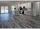Open-concept kitchen featuring an island, sleek countertops, stainless steel appliances, and stylish pendant lighting at 2693 Sw 153Rd Place Rd, Ocala, FL 34473