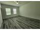 Bright living room featuring two windows and a ceiling fan at 2693 Sw 153Rd Place Rd, Ocala, FL 34473