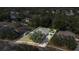 Aerial view of the house showing the neighborhood with mature trees and manicured lawns at 2814 Breezy Meadow Rd, Apopka, FL 32712